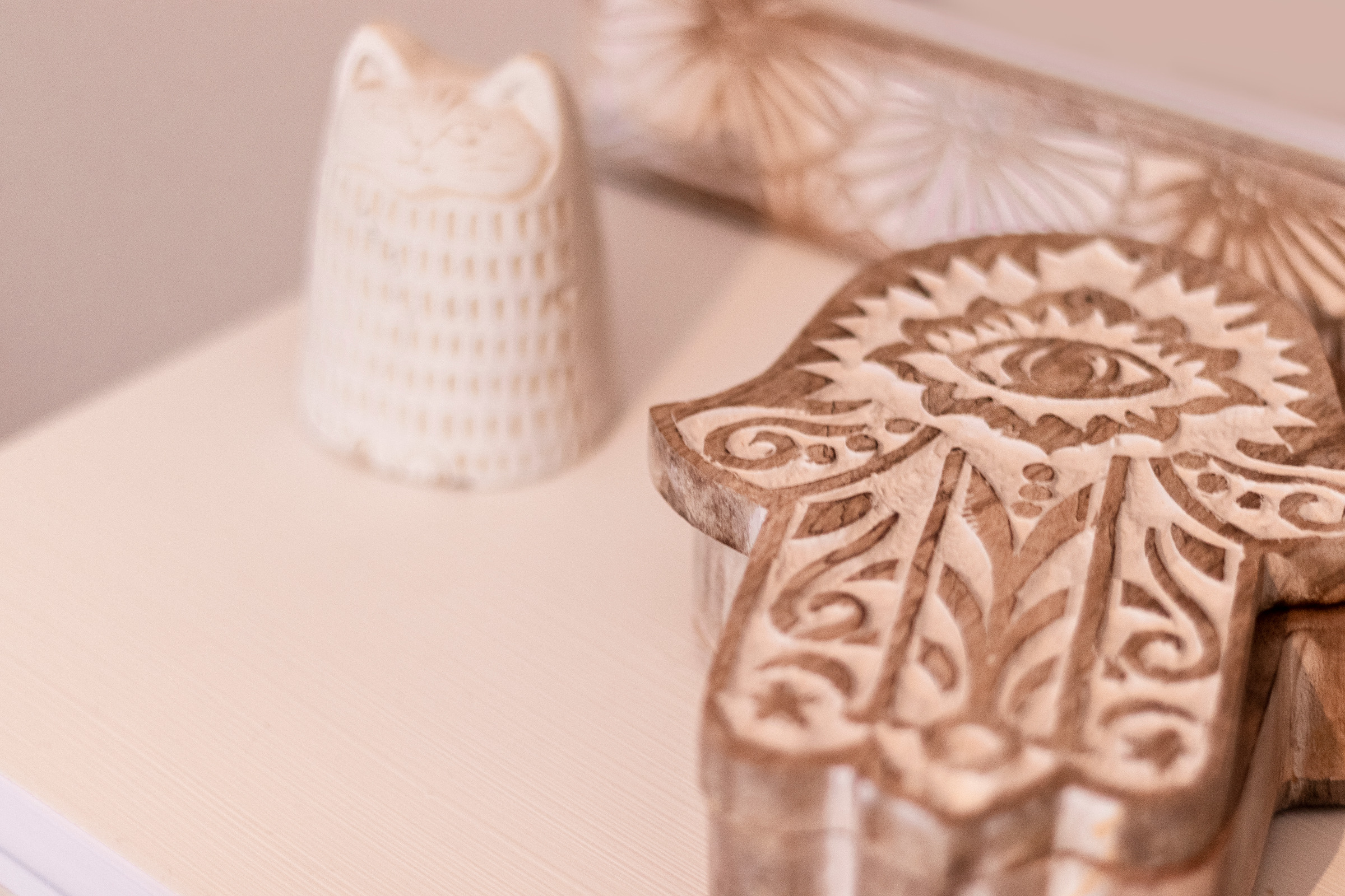 Wooden Hamsa Carving on the Table